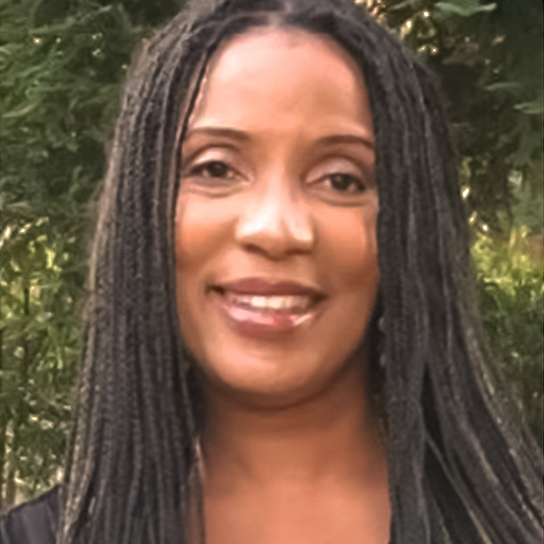 Headshot for LaWanda - Black woman with long black braids smiling at the camera