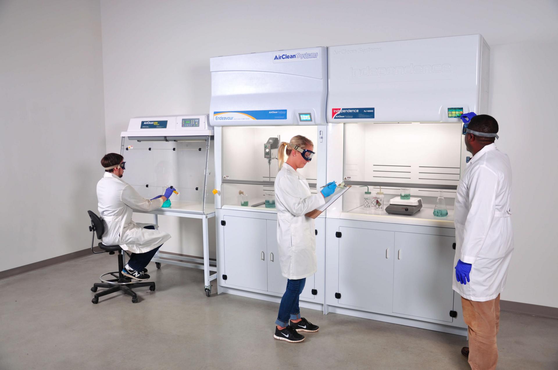 AirClean Systems variety of ductless fume hood cabinets in use by technicians