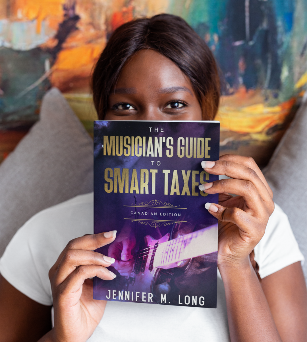 Woman holding a copy of book against a colourful painted background