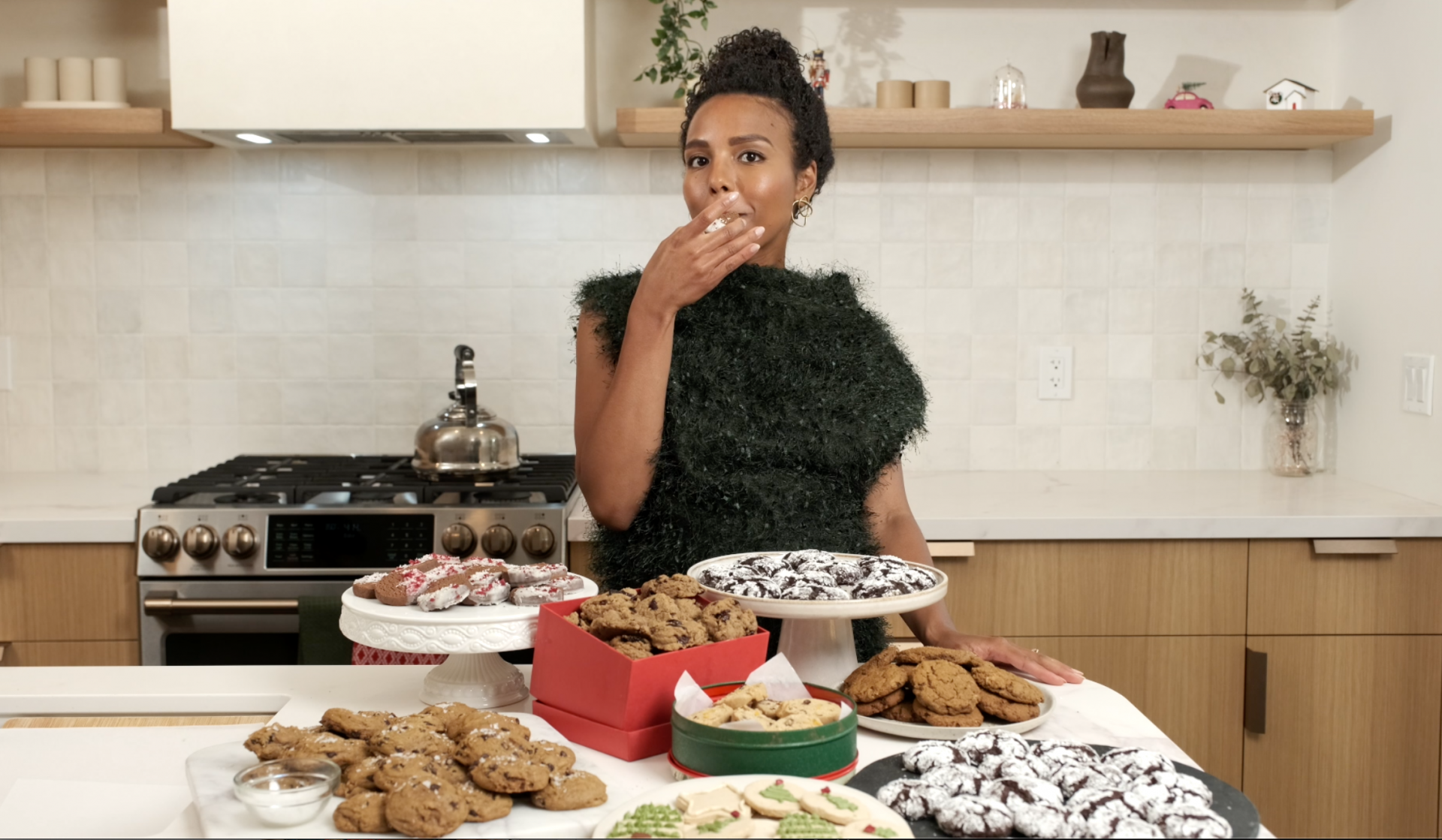 image of course instructor in front of a counter with 6 different cookie platers