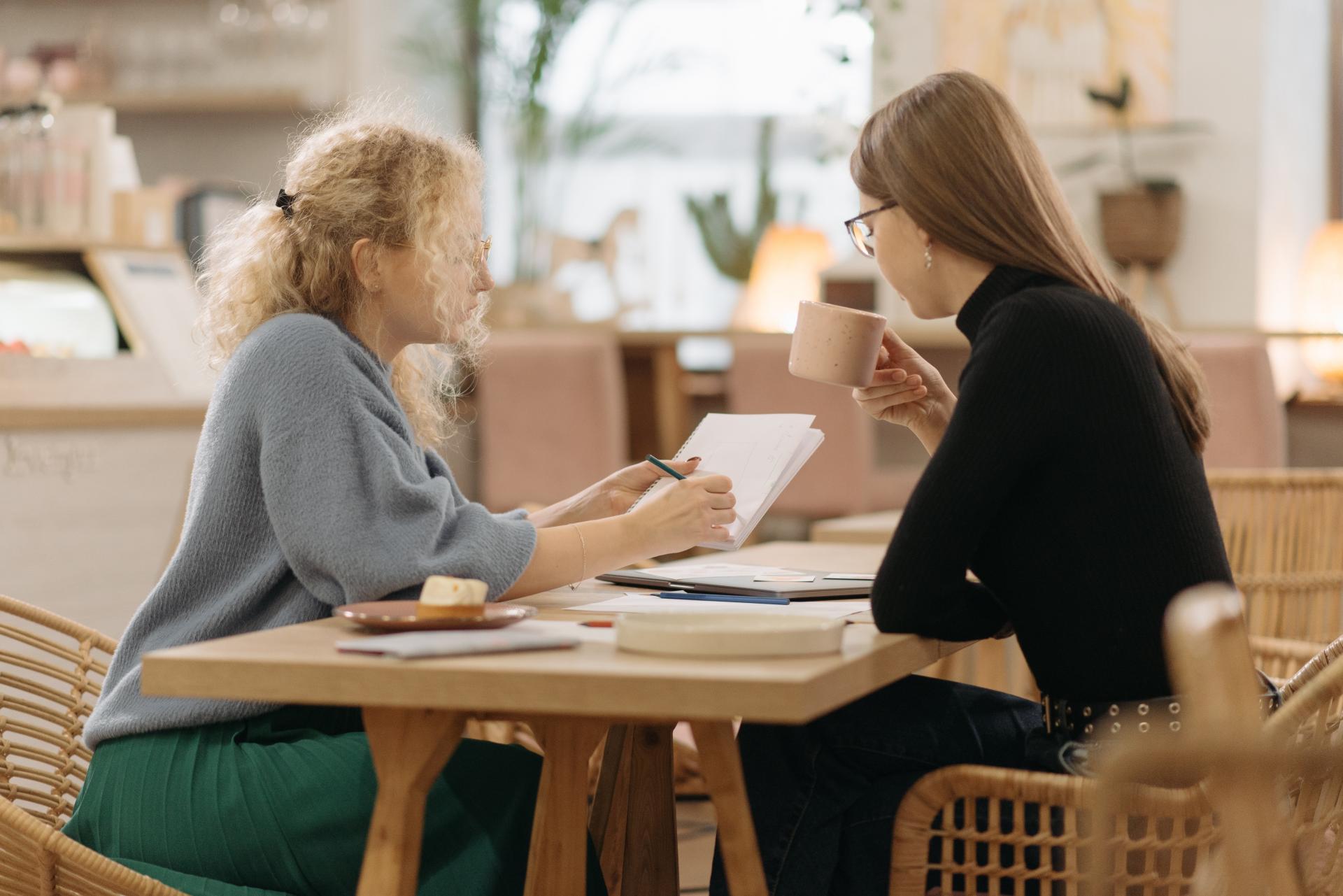 Two Women meeting at Coffee Shop