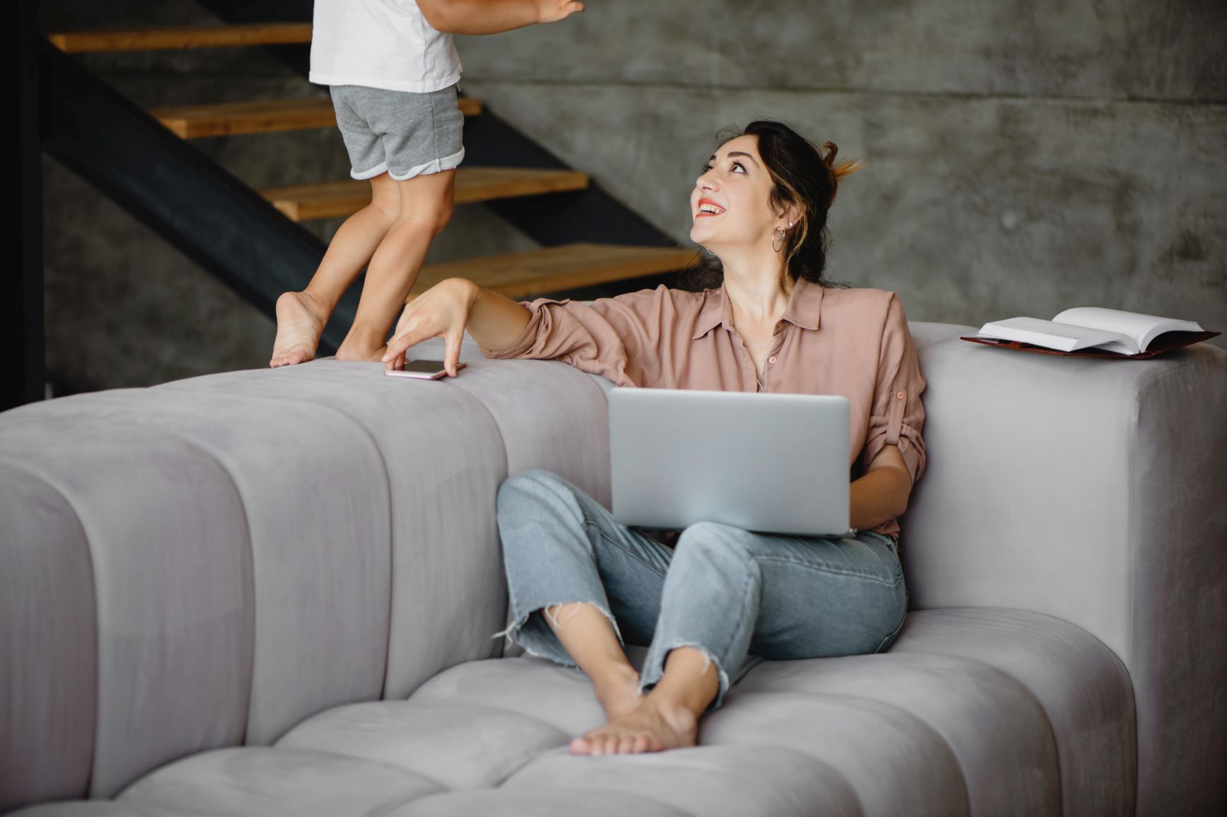 Working mom with kid walking on the couch - Life Ninjas, Misty Dorman