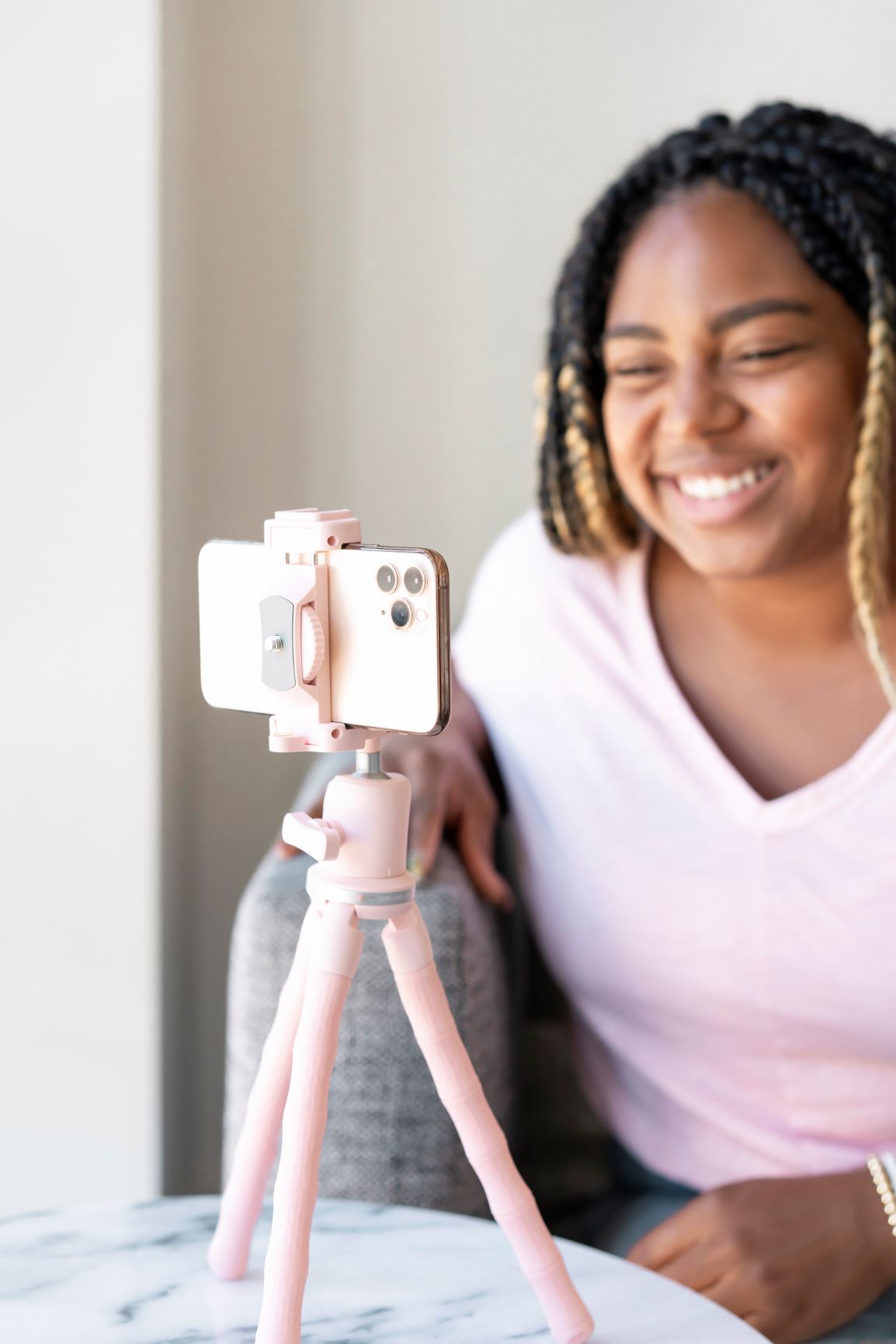 Black woman smiling at cell phone - Misty Dorman, Life Ninjas Training