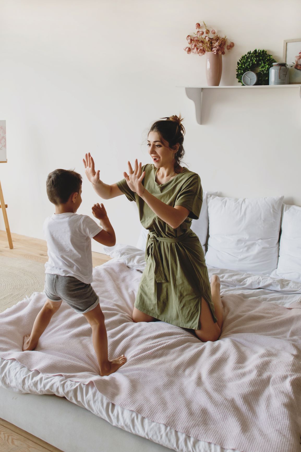 mom and kid playing on a bed - Misty Dorman, Life Ninjas
