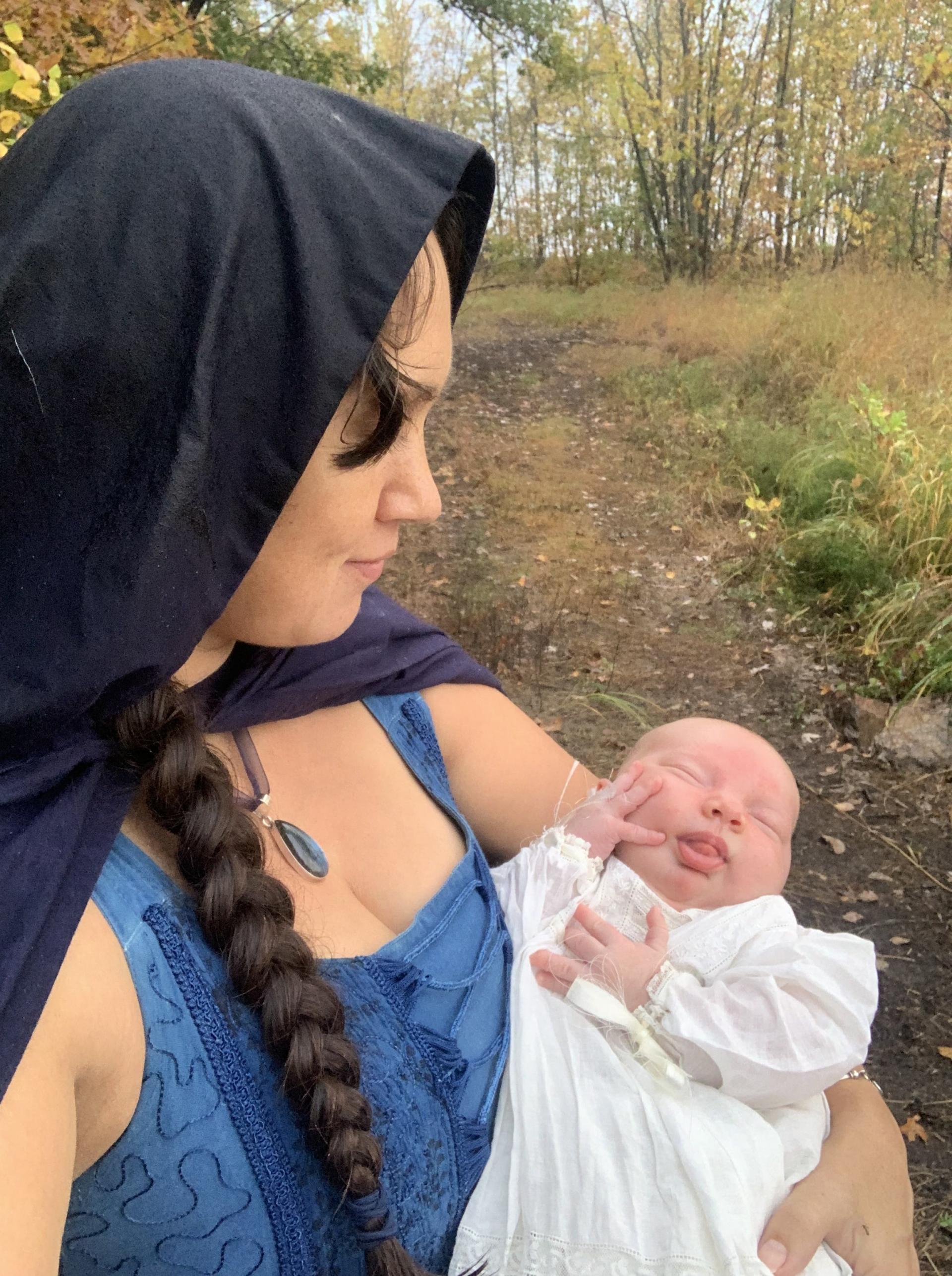 Allysha Lavino in traditional priestess dress at Izzy's water blessing