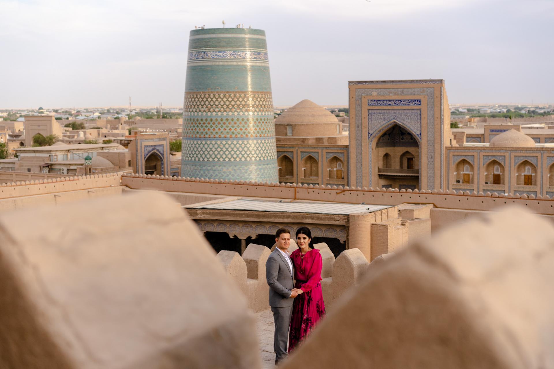 View over Bukhara rooftops towards iconic minaret at sunset - Uzbekistan small group photo tour.