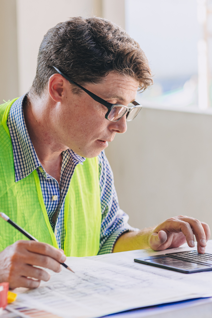 Construction owner calculating a job audit