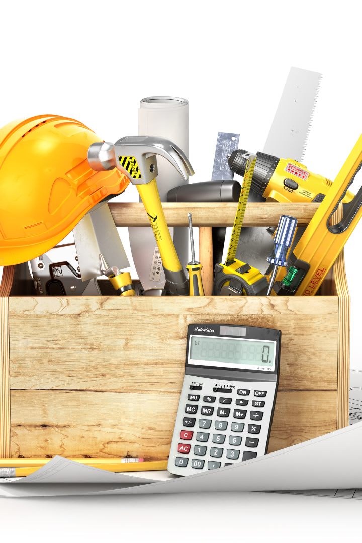 Wood toolbox filled with construction tools with a calculator in front