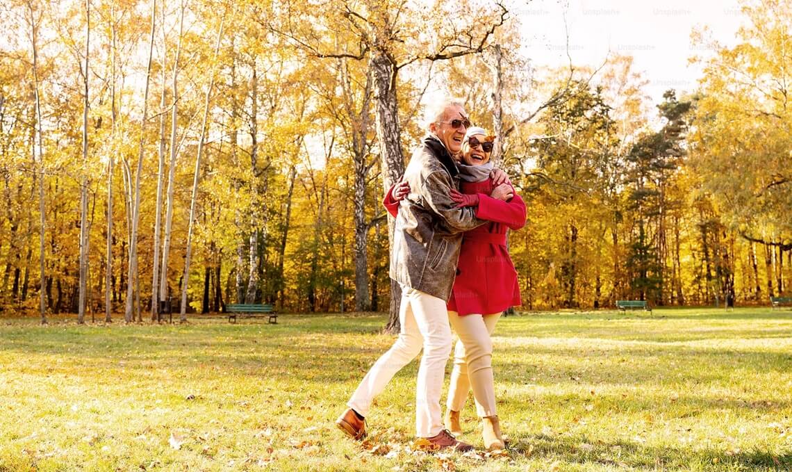 happy senior couple in the park