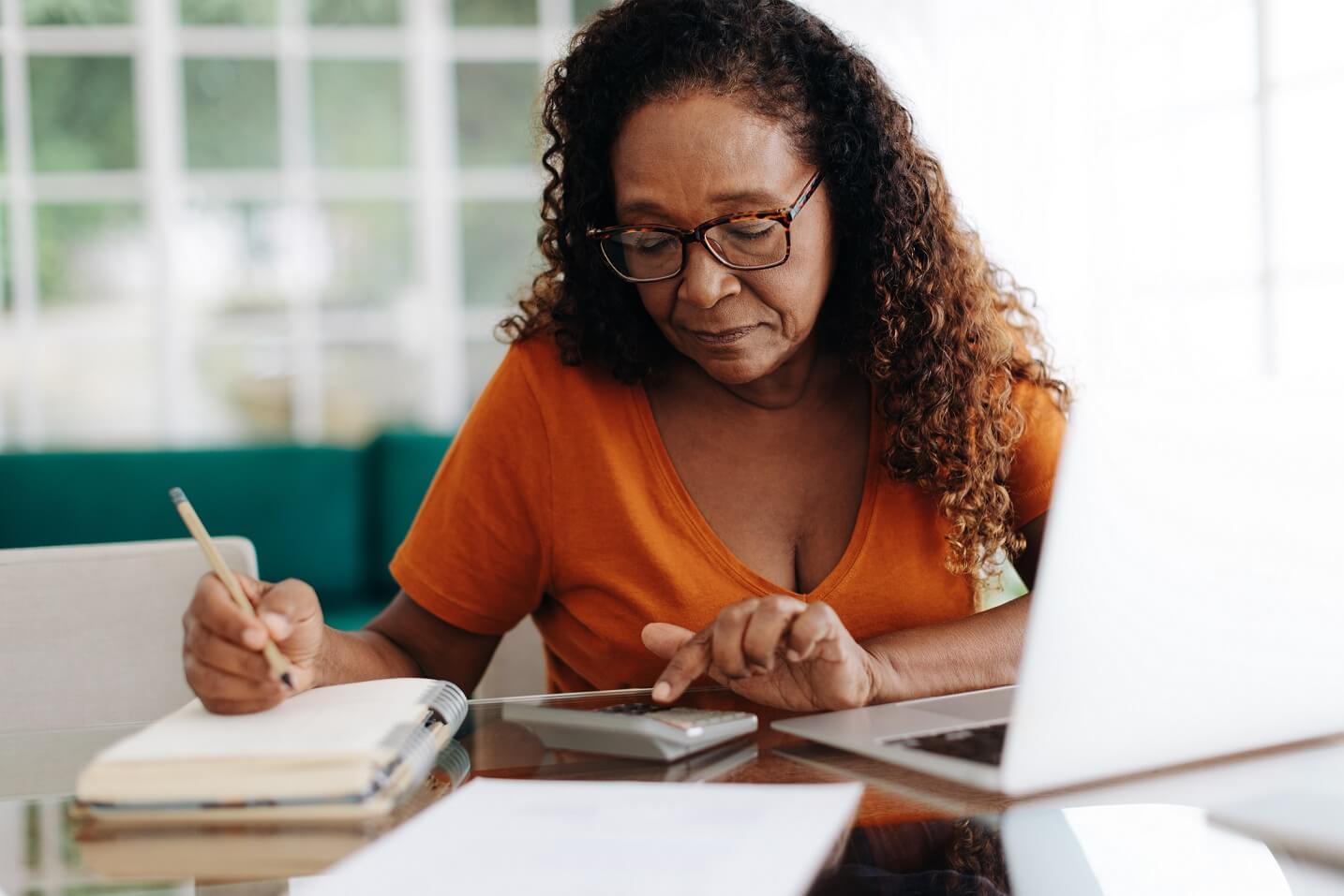 woman calculating surrender penalties