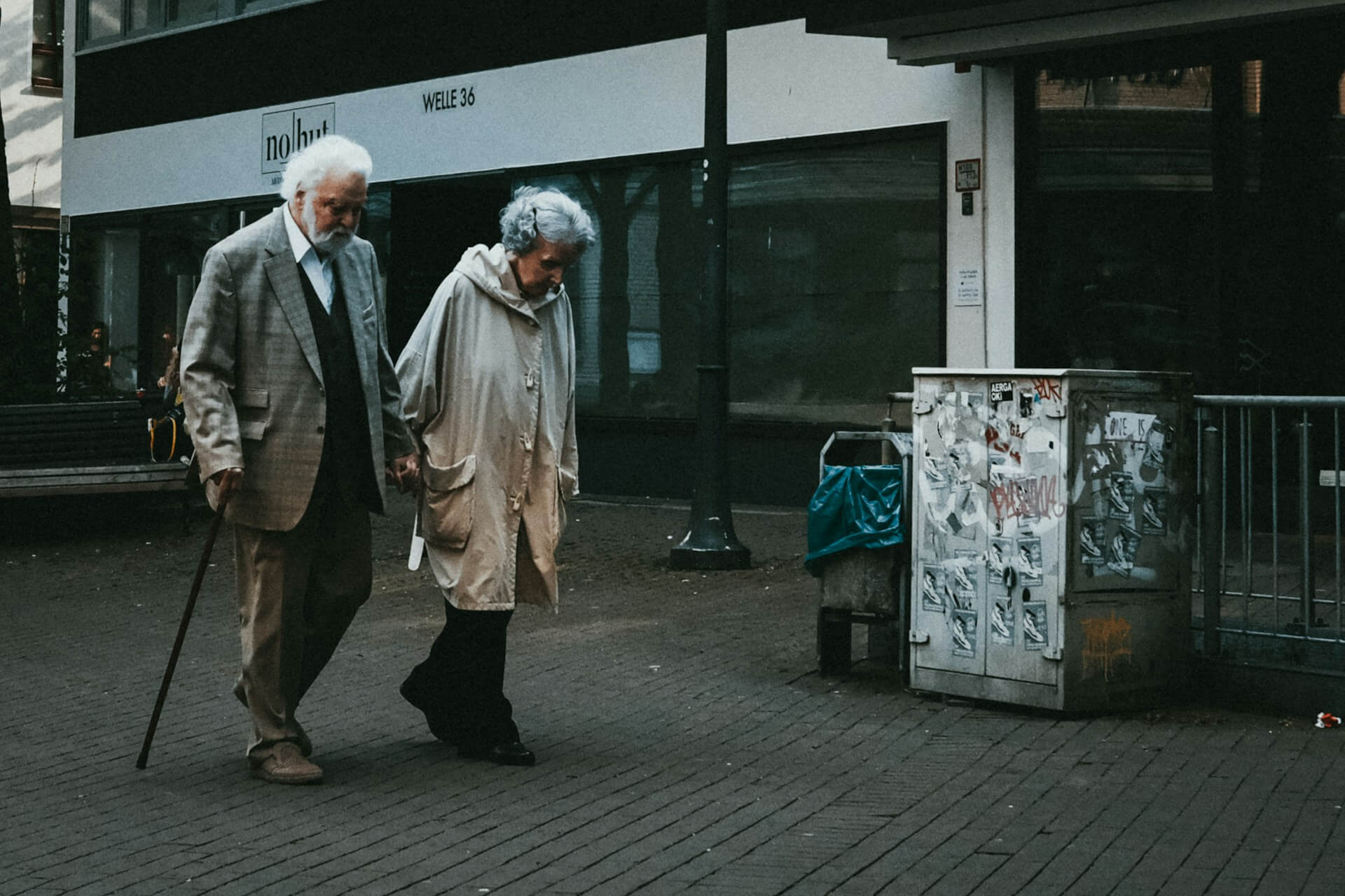 a senior couple walking on a street
