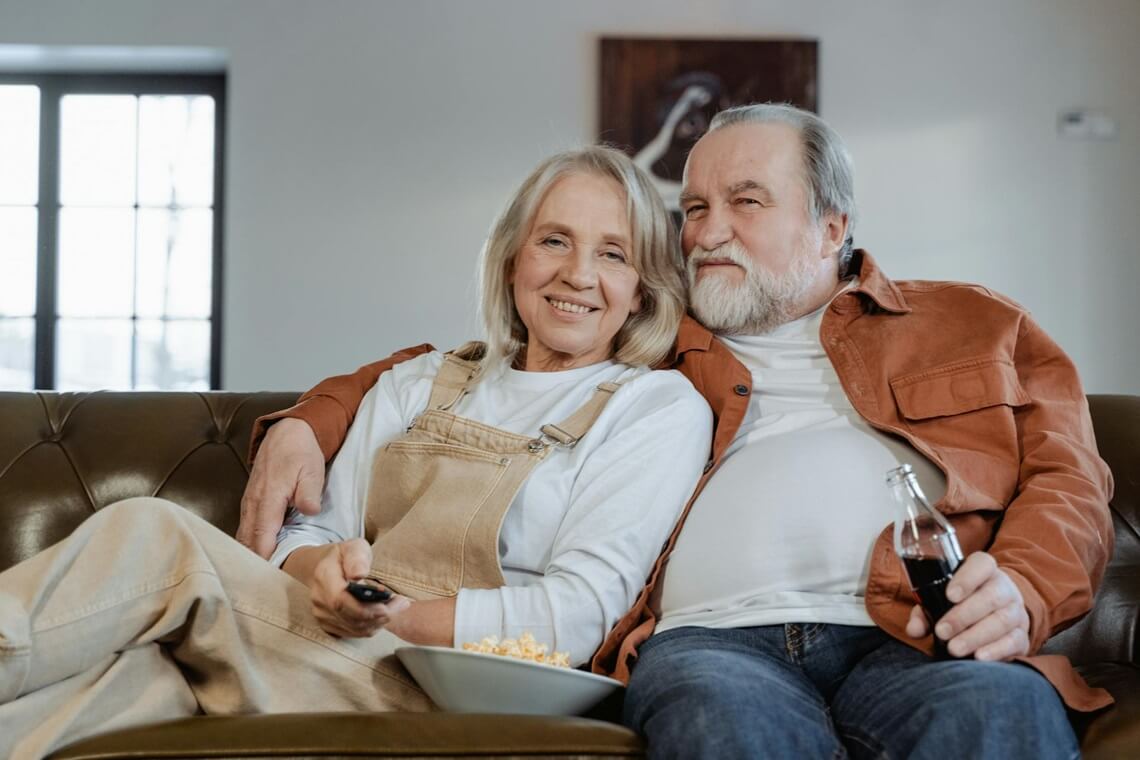 elderly couple sitting