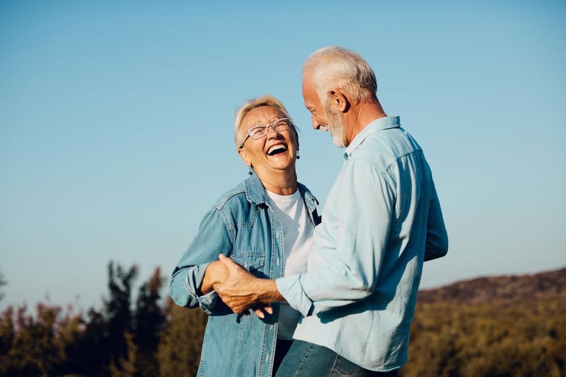 two people sitting on a bench