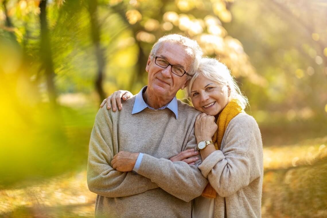 happy senior couple in a park