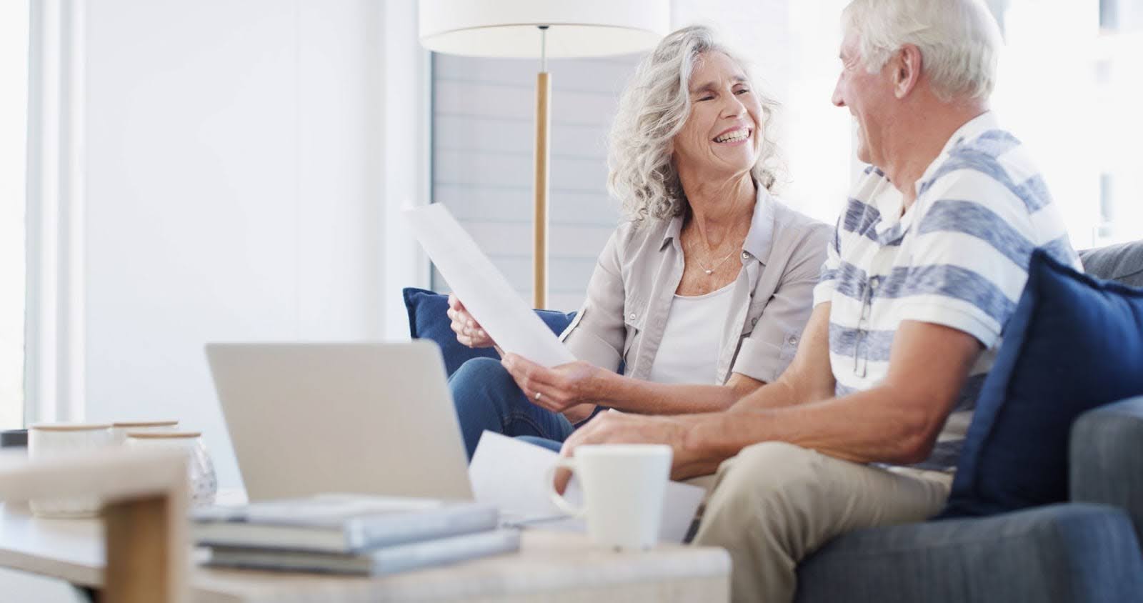 a happy senior couple comparing index annuity vs fixed annuity vs variable annuity