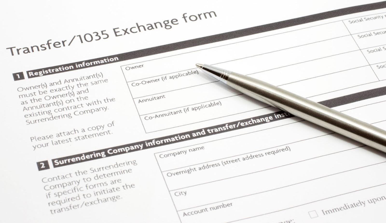 Section 1035 Exchange paper form with a silver pen on it