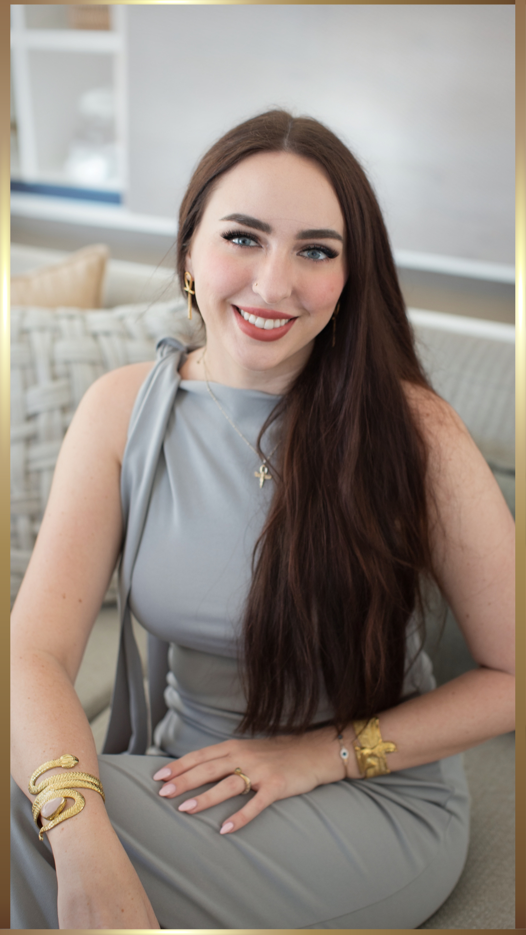 A lady with long hair enjoying her morning coffee.