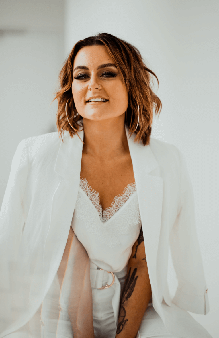 A stunning woman with long hair and a fashionable red top, looking fabulous.