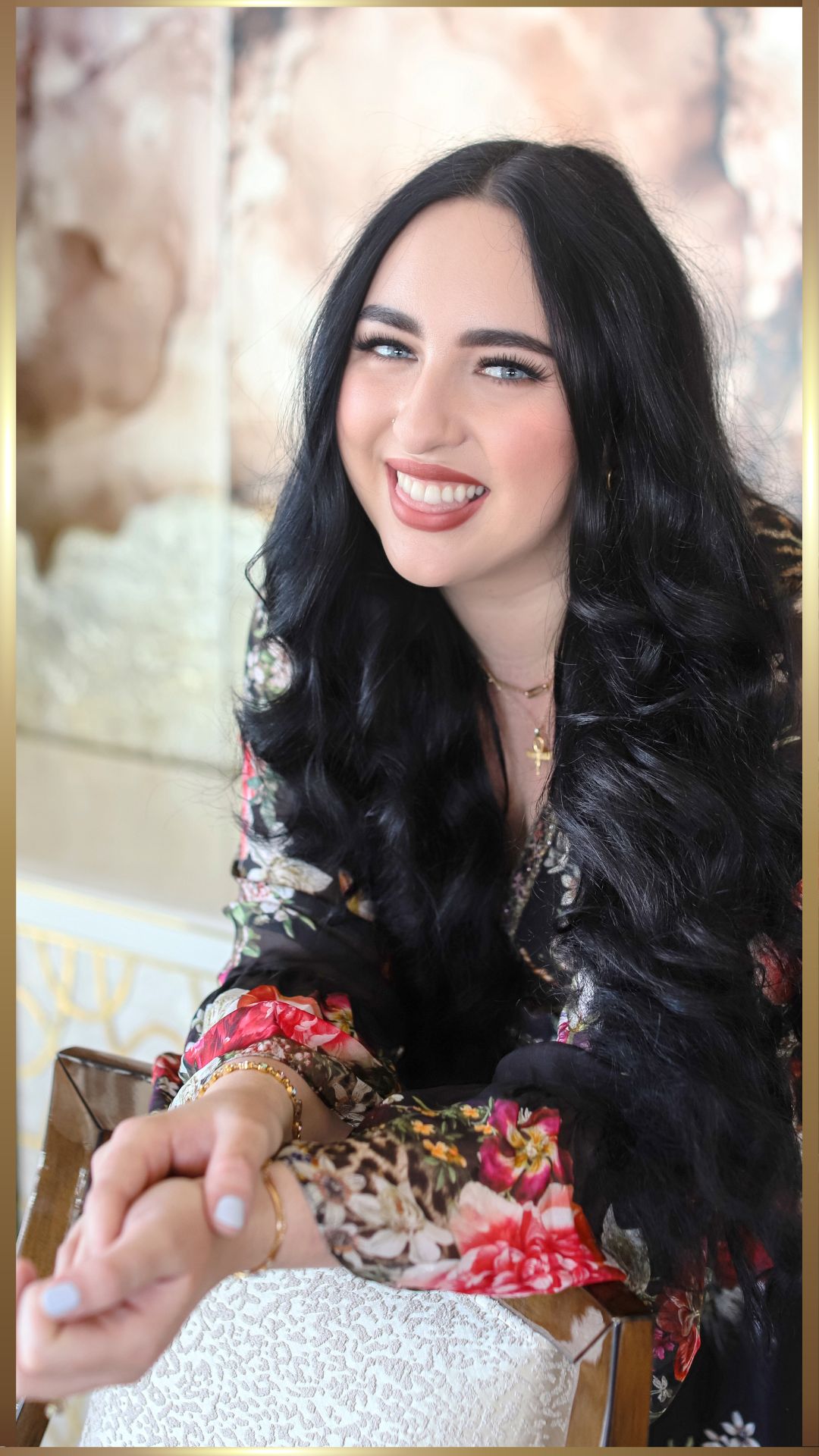 A lady with long hair enjoying her morning coffee.