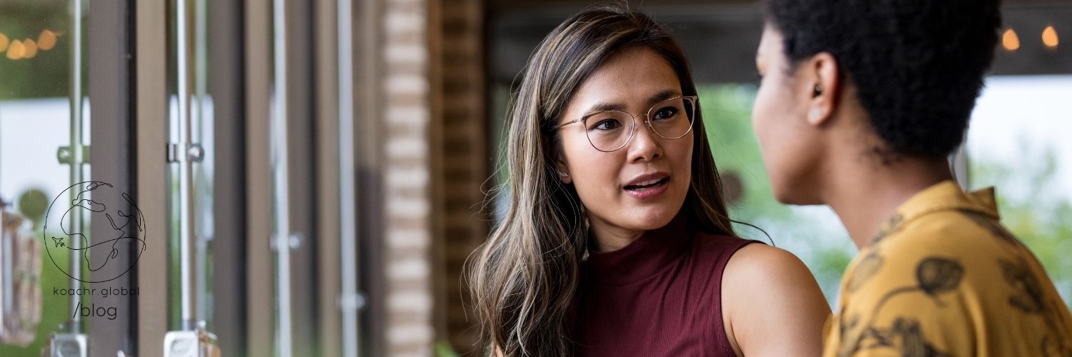 Two professional women talking.