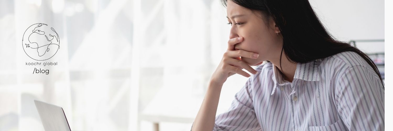 Woman pondering her application writing