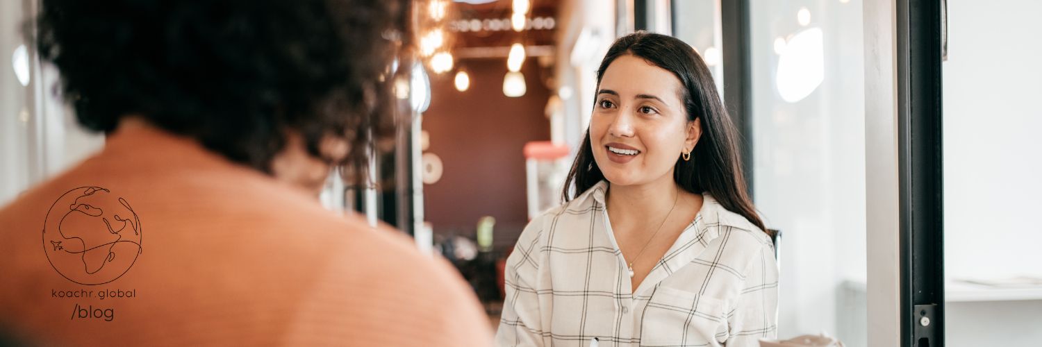 Woman being interviewed, pondering what examples she should use to illustrate her competencies.