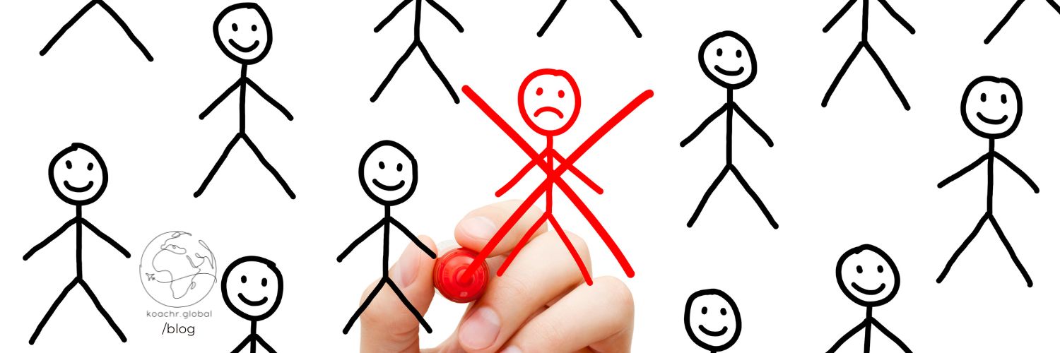 Happy stick figures in black, with a hand holding a marker crosses out a sad stick figure in red