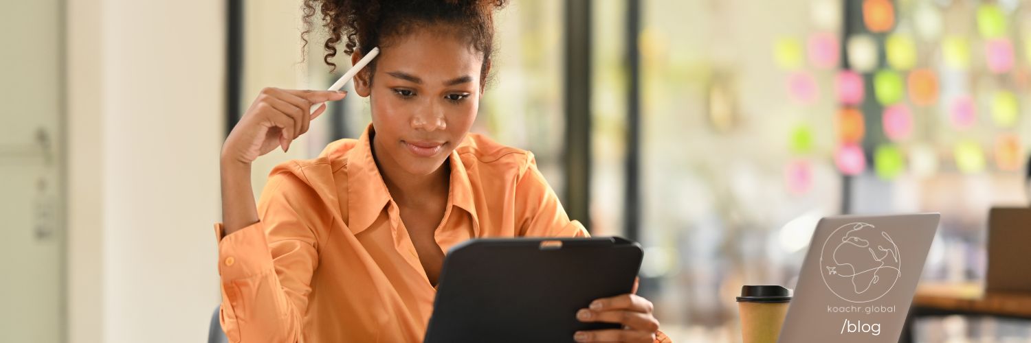 Woman at a desk, focusing intently on her work