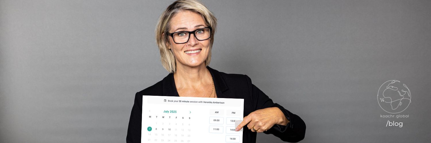 Coach Veronika holding her calendar, which is open for booking of career support and professional development services