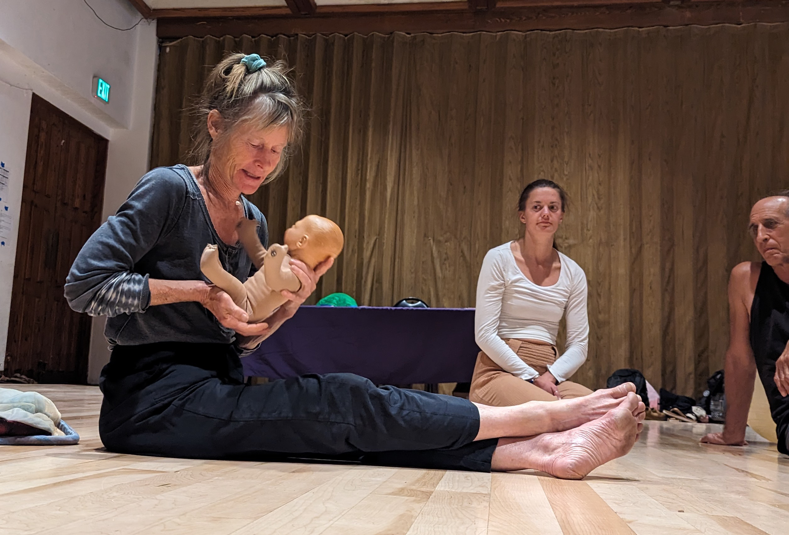 Annie Brook demonstrates supporting a baby
