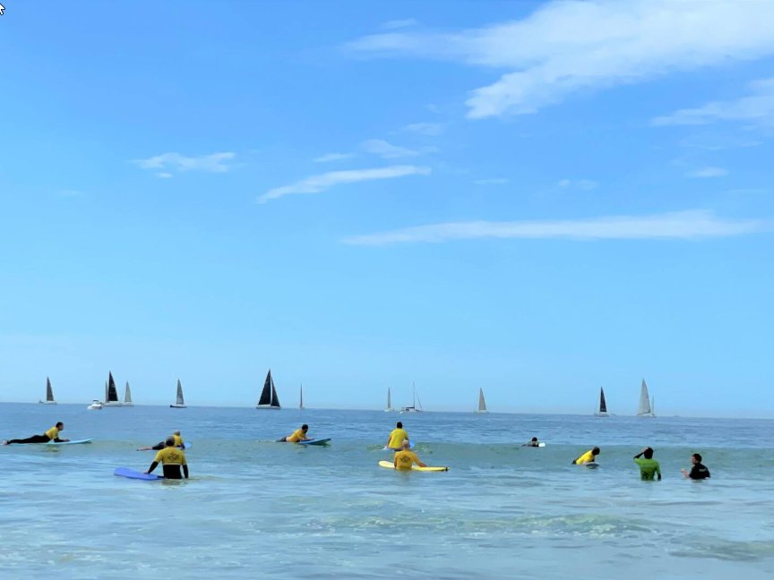 woman walking a large grass labyrinth