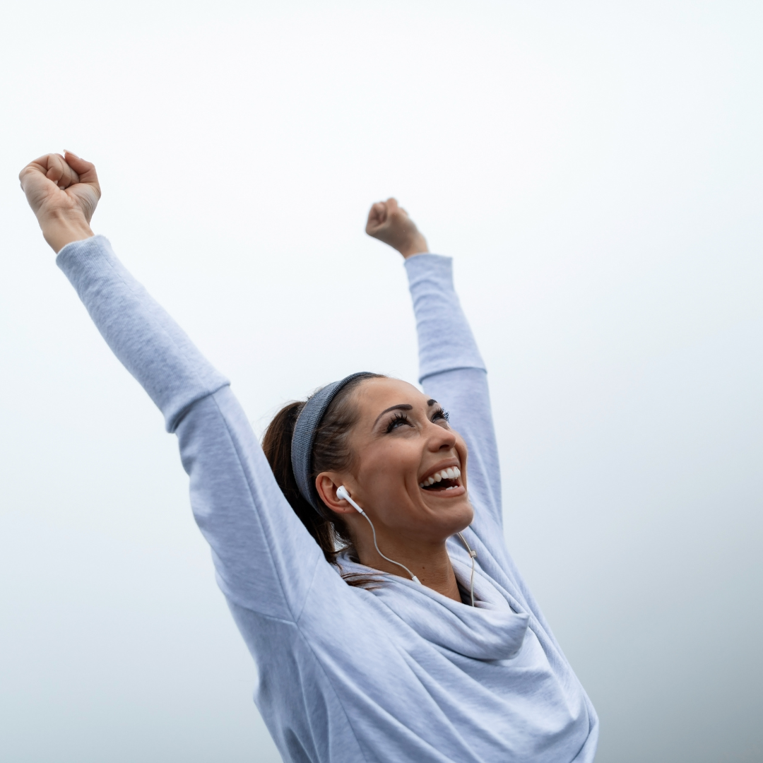 woman celebrating weight-loss success