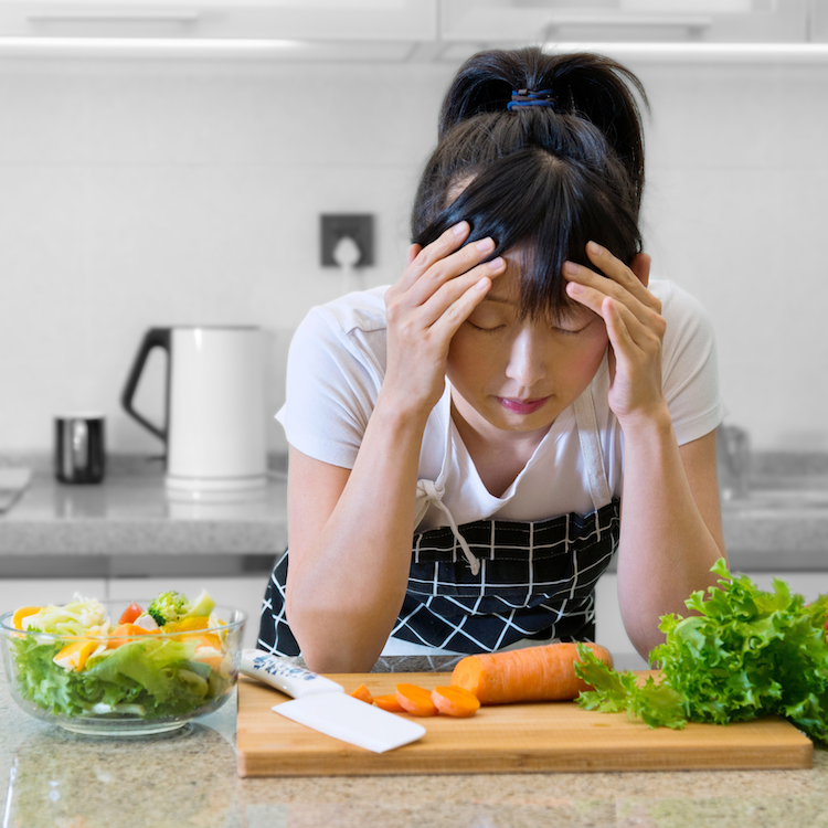 tired woman with veggies