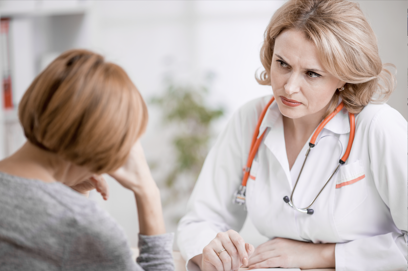 Lady doctor talks to patient