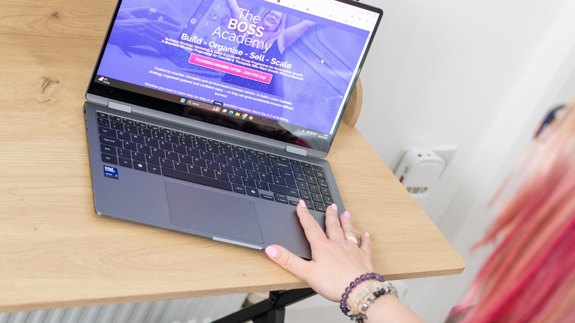 Dani looking at The BOSS Academy on her laptop