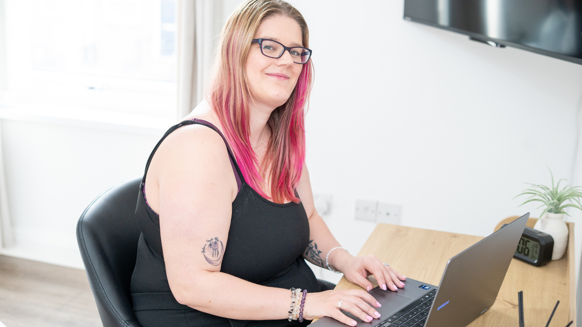 Dani working at her laptop