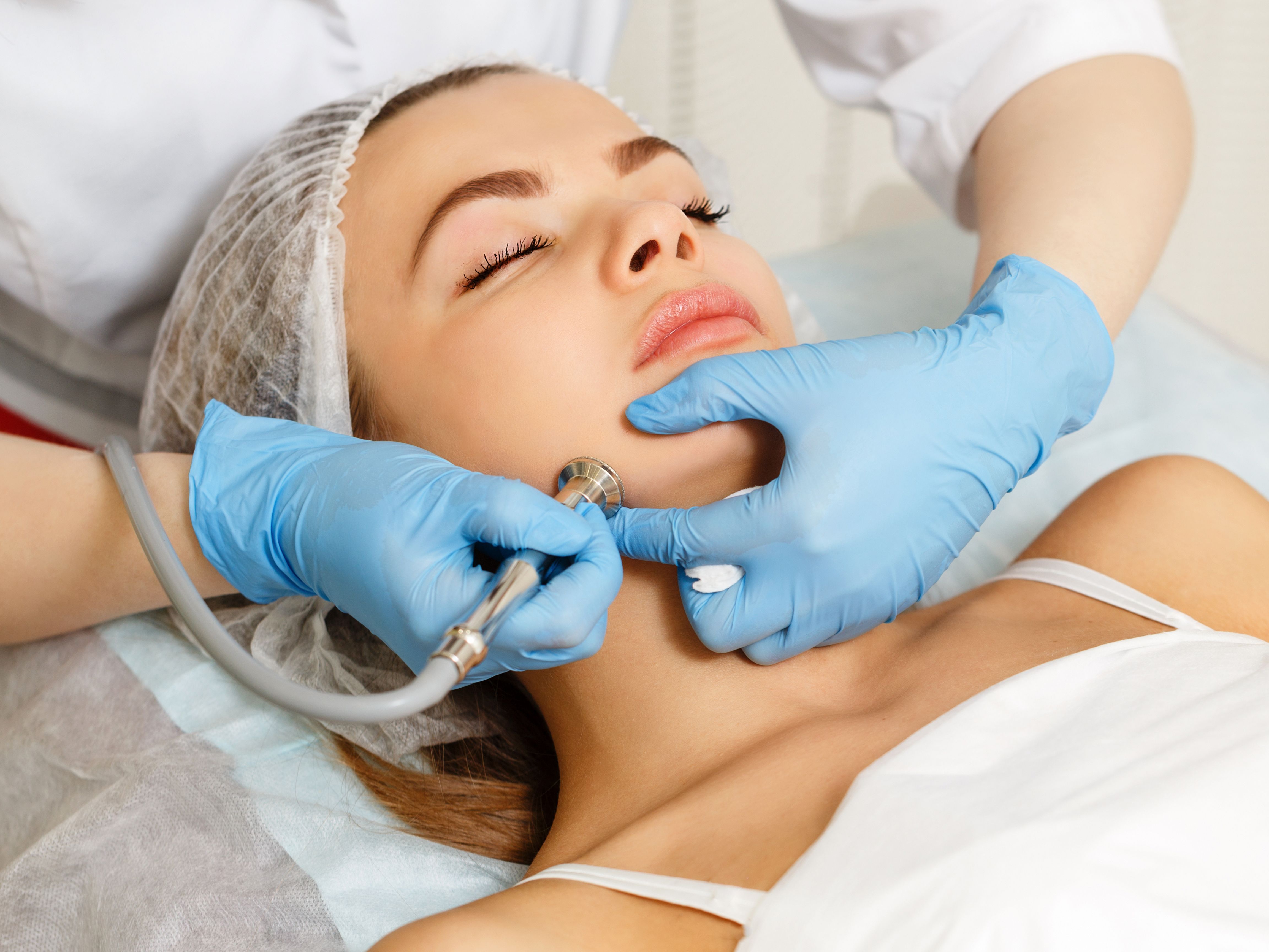 woman receiving natural facial and microdermabrasion treatment in Houston