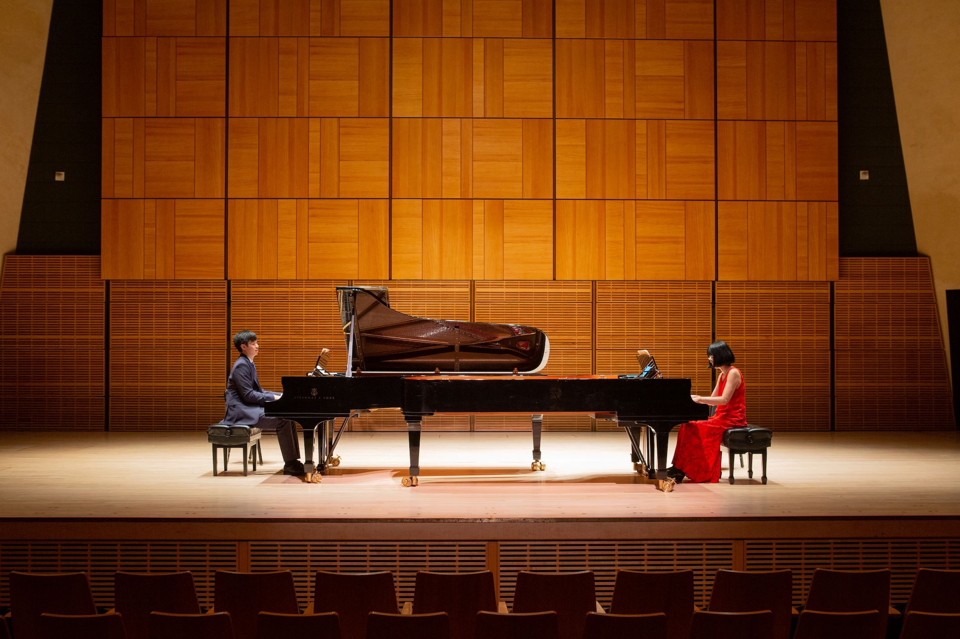 Michelle and Christopher Kuo of Two Piano Journey performing a two-piano concert to benefit nonprofit partners