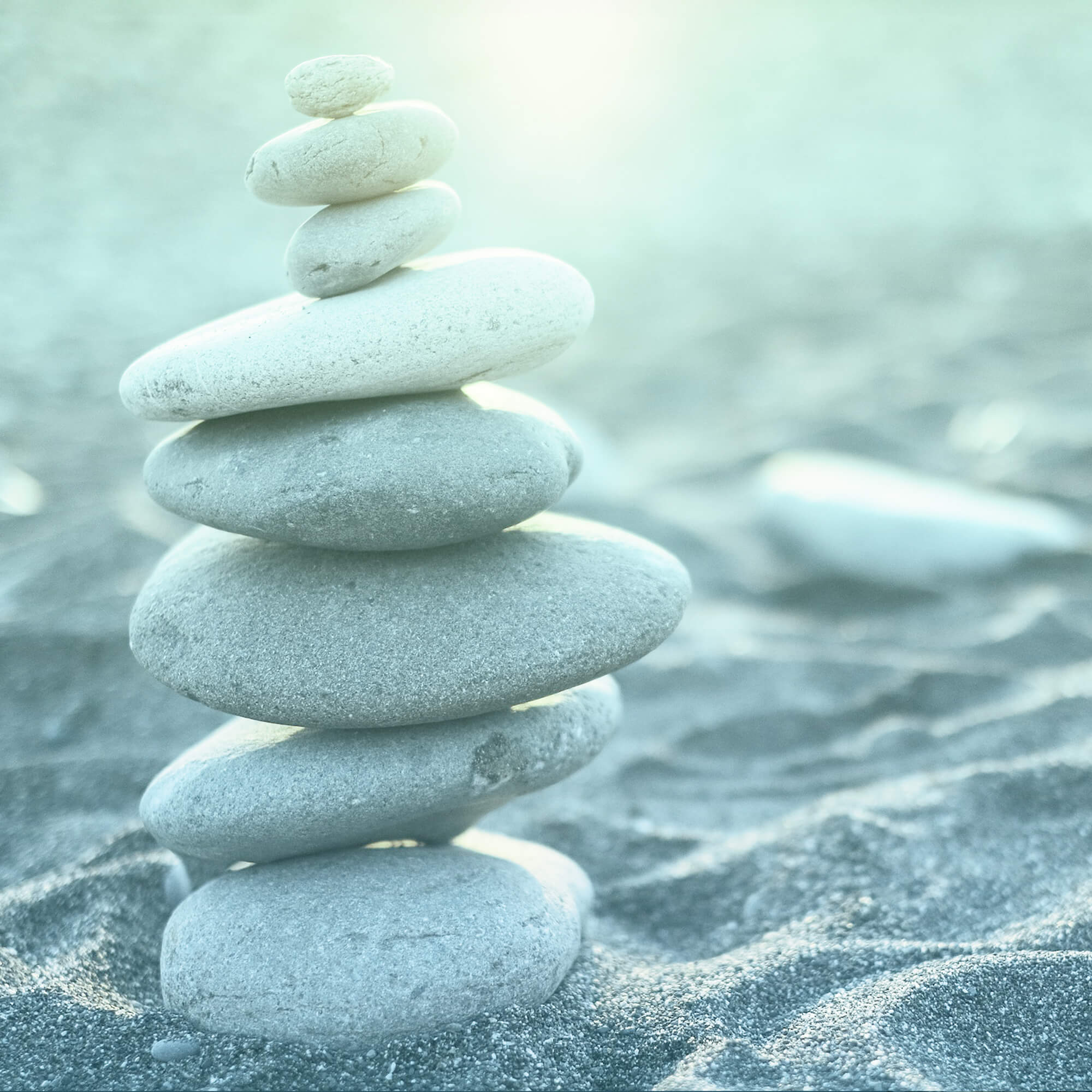 Stacked stones on a sandy beach