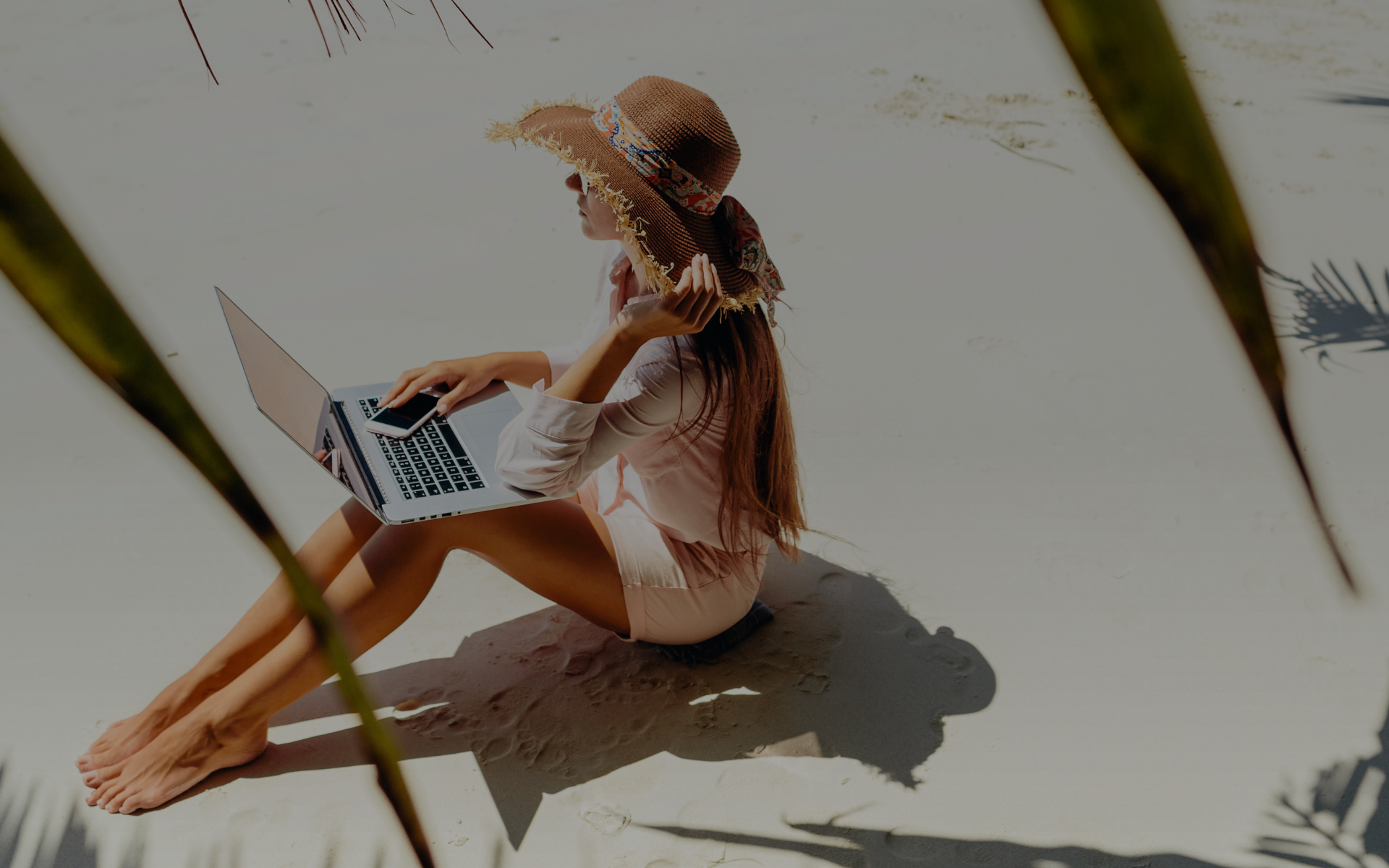 Cultured Insider Woman On Beach With Laptop