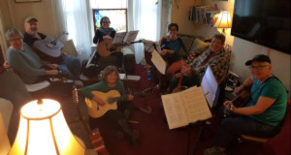 Janet's student practicing guitar