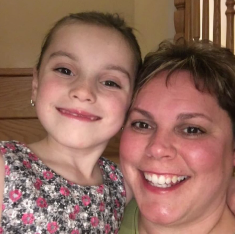 mom and a photo of her deceased daughter