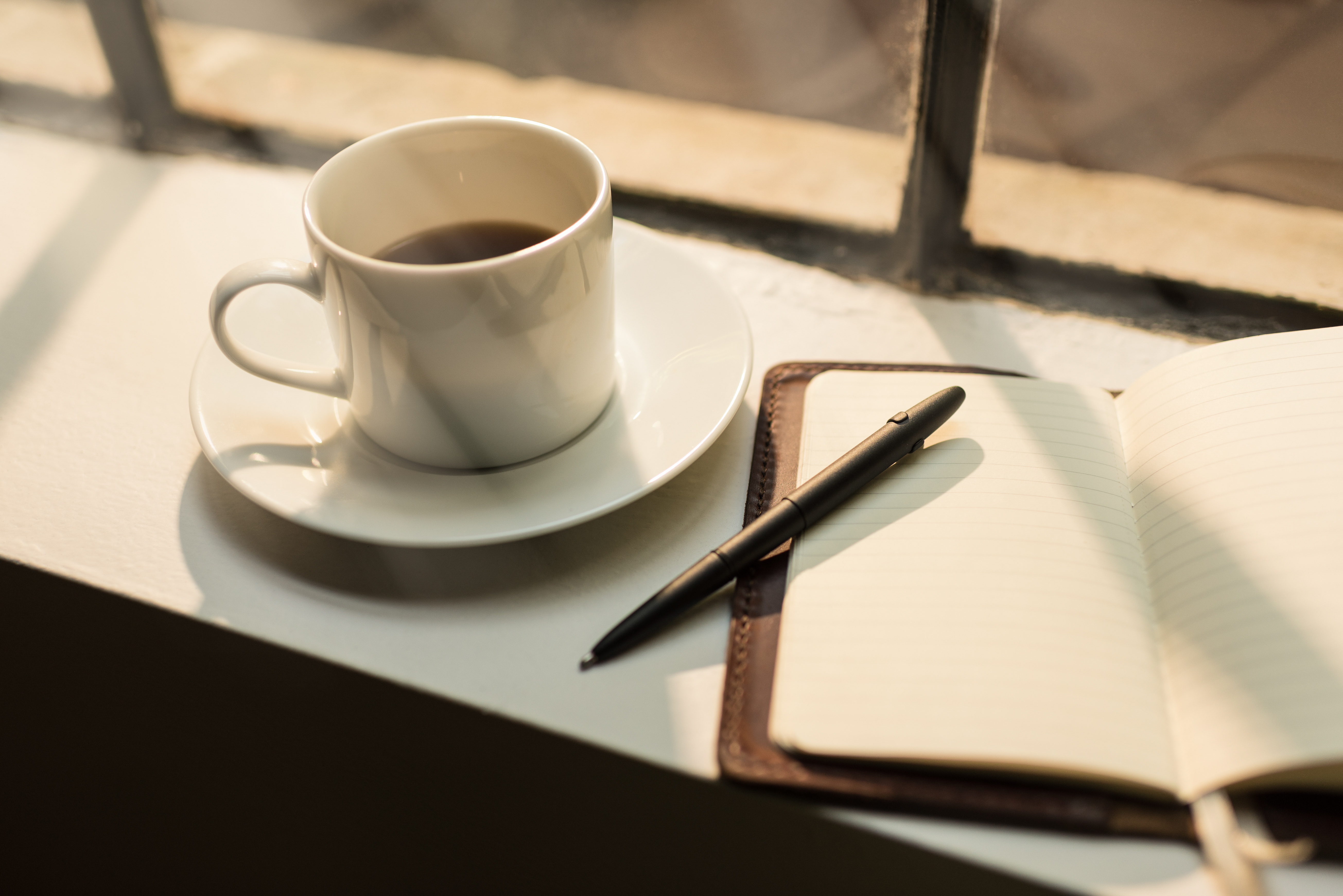 Image of a planner and coffee
