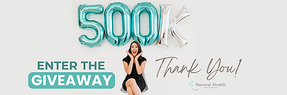 Excited woman sitting with '500K' balloons, celebrating the milestone of reaching 500,000 YouTube subscribers