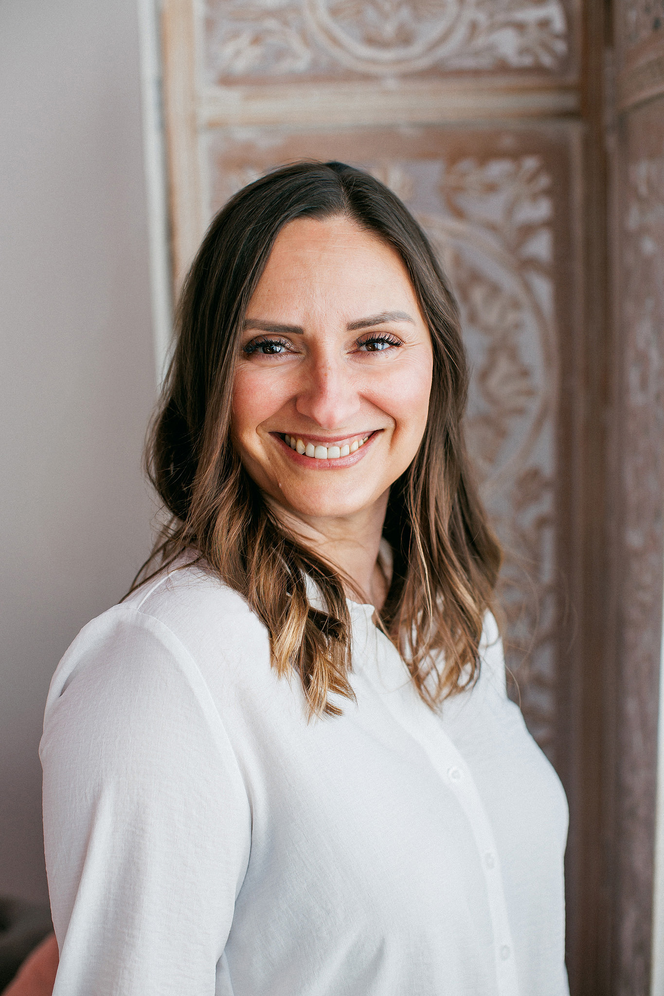 Woman sitting on a couch smiling