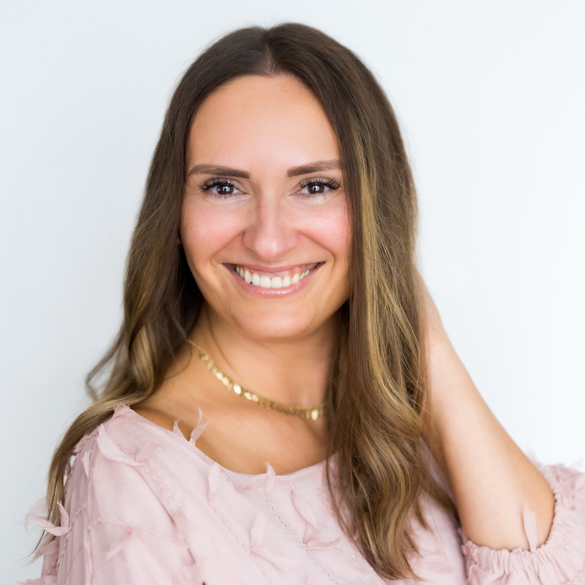 Female coach smiling.