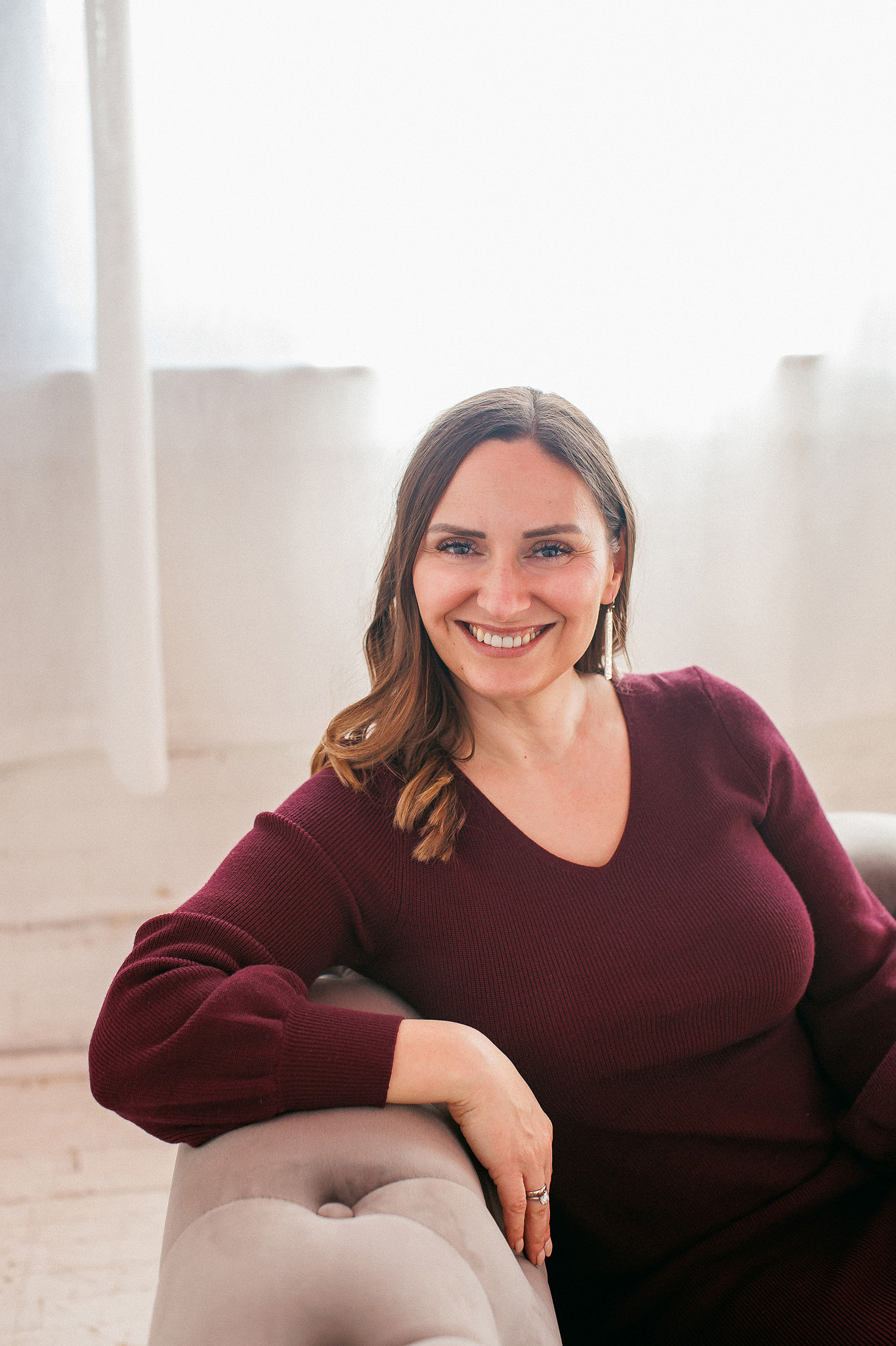 Female intimacy coach smiling.