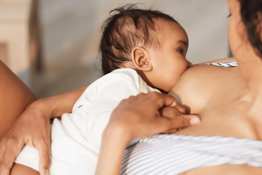 a photo of a mother breastfeeding her baby