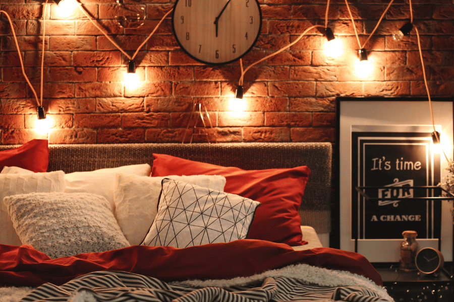 a photo of a cosy bedroom with low lighting