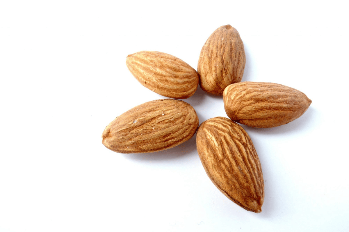 a cluster of almonds on a white background